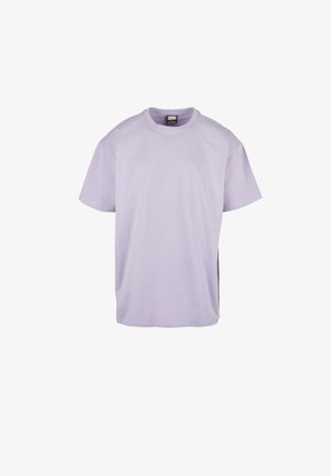 Lavendelfarbenes Baumwoll-T-Shirt mit kurzen Ärmeln, Rundhalsausschnitt und lockerer Passform. Hat ein simples Design, eine glatte Textur und eine einfarbige Ausführung.