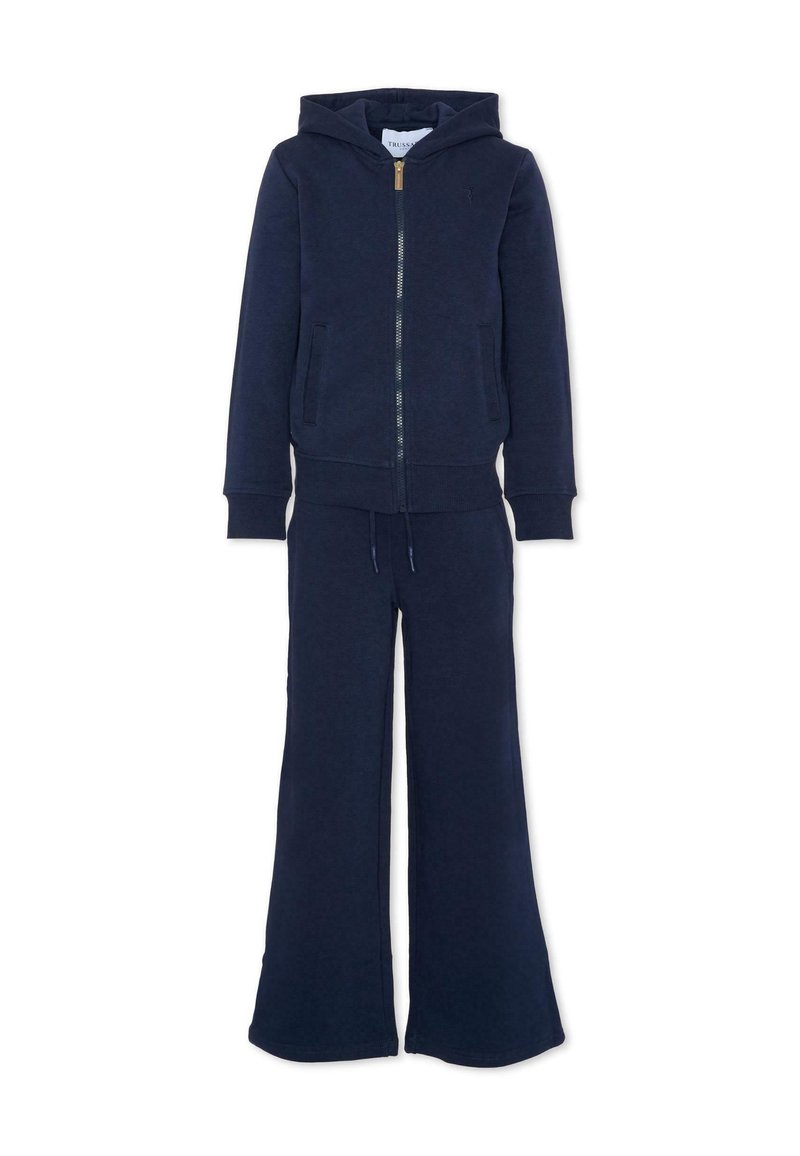 Marineblauwe hoodie met frontale rits en bijpassende wijde broek, voorzien van zakken en een taille met trekkoord, weergegeven op een witte achtergrond.
