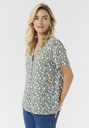 Short-sleeve shirt in green floral print, featuring a V-neck and button front. Made of lightweight fabric with a relaxed fit.