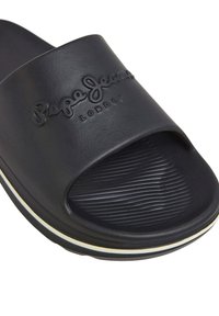 Sandal nera con una larga fascia, logo in rilievo, soletta sagomata e bordatura bianca a contrasto attorno alla suola. Realizzata in materiale durevole.