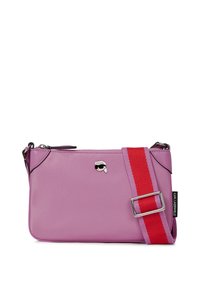 Pink synthetic crossbody bag with a red and pink striped strap, featuring a small logo detail and a zippered compartment. Compact design.