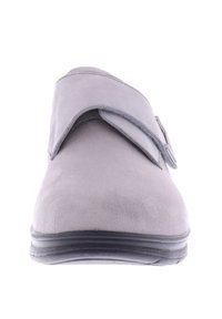 Gray suede slip-on shoe with a rounded toe, adjustable upper strap, and a flexible black rubber sole. Smooth texture with minimal detailing.