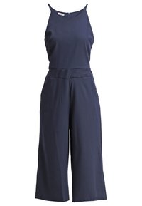 Mono azul marino con corpiño ajustado, piernas anchas y cortas, y cremallera en la parte posterior. Fabricado en tejido suave y ligero con tirantes ajustables.
