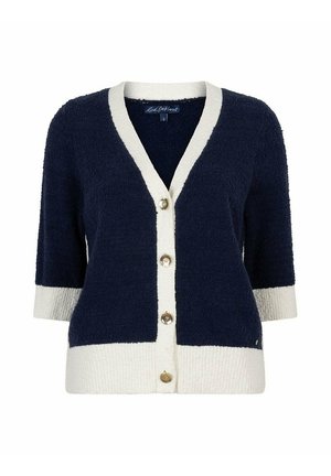 Marineblauwe cardigan met witte bies op de kraag, manchetten en zoom, voorzien van vier gouden knopen en driekwart mouwen.