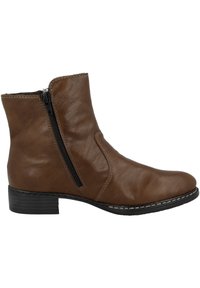 Braune Leder-Stiefelette mit einem seitlichen Reißverschluss, runder Zehenform und niedrigem, gestapeltem Absatz, mit weißem Nähten entlang der Sohle.