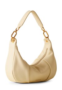 A light yellow leather bag with a curved shape, featuring a zippered closure and gold hardware accents for the strap attachment.