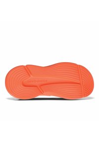 Orange rubber sneaker sole with textured wave patterns and grooves. Features "new balance" logo embossed on the side.