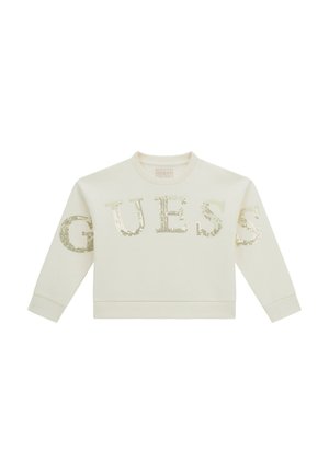 Felpa a maniche lunghe color crema con colletto a girocollo, decorata con lettere in paillettes dorate che formano la scritta "GUESS" sul davanti e sulle maniche.