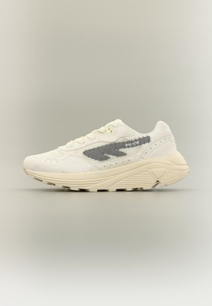 Cream-colored athletic sneaker with thick textured sole, light gray side logo, mesh and suede panels, viewed from the left side on a plain background.