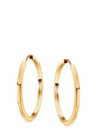 Złote kolczyki w kształcie obręczy o gładkiej, wypolerowanej powierzchni. Okrągły kształt z delikatnie grubym profilem. Projekt z bezpiecznym zapięciem.