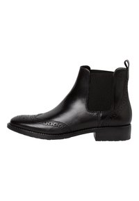 Bottes Chelsea en cuir noir avec des détails en brogue, panneaux latéraux élastiques, petit talon et une languette à l'arrière.