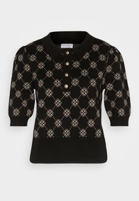 Haut en maille noir à manches courtes avec motif floral en losanges beige, boutons dorés, col et manches retroussées.