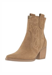 Bottes chevilles en daim beige avec un bout pointu, des coutures décoratives, des tirettes et un talon empilé. Texture lisse avec un détail de design western.