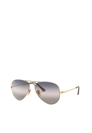 Occhiali da sole aviator con una sottile montatura in metallo dorato, lenti grigie sfumate e terminali in plastica marrone sulle tempie. Naselli trasparenti per il comfort.