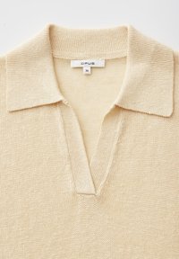 Cream-colored knitted top with a wide collar, V-neck opening, and an "OPUS" brand label showing size 36.