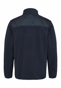 Giacca di pile blu navy con colletto alto, tessuto morbido sulle spalle, maniche lunghe e orlo piatto. Nessun fissaggio o logo visibile.