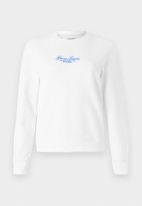 Felpa bianca realizzata in tessuto strutturato, con scollatura rotonda, maniche lunghe e logo ricamato blu con la scritta "Guess Jeans" e del testo sottostante.