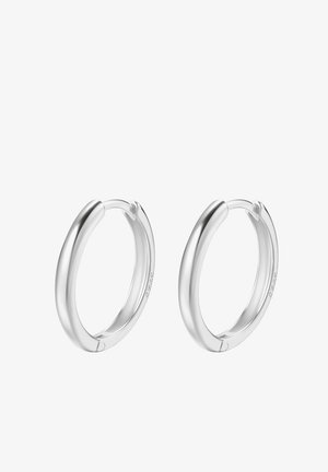 Boucles d'oreilles créoles en argent poli avec un design sans couture. Elles présentent une forme arrondie et une texture lisse, adaptées pour un usage décontracté ou formel.