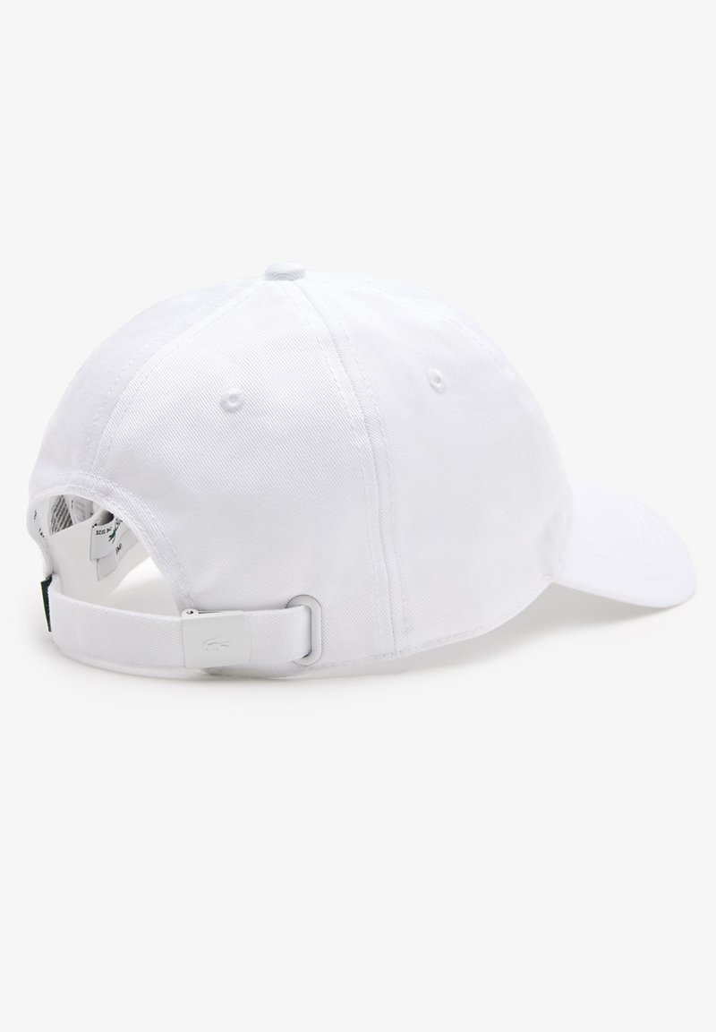 Gorra de béisbol de algodón blanca con visera curvada, correa ajustable en la parte trasera y agujeros de ventilación en la parte superior y los lados.