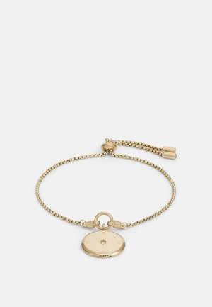 Goldverstellbares Kettenarmband mit rundem Kompassanhänger, der die Richtungen Norden, Süden, Osten und Westen zeigt, sowie einem kleinen zentralen Edelstein.