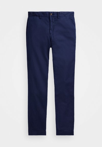 Námornícky modré chinos vyrobené z bavlny, s klasickým dizajnom, gombíkovým zapínaním, bočnými vreckami a rovnými nohavicami.
