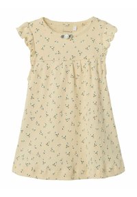 Gul blommig klänning i ribbat tyg, med volangärmar och knapppdetaljer, en samlad midja och små gröna blommönster.