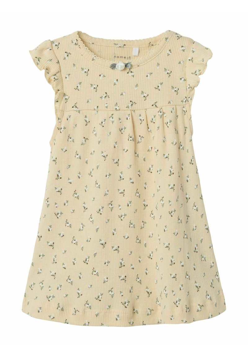 Gul blommig klänning i ribbat tyg, med volangärmar och knapppdetaljer, en samlad midja och små gröna blommönster.