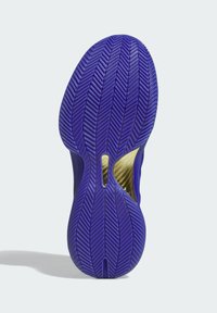 Suola delle scarpe in gomma viola vibrante con un motivo a spina di pesce, caratterizzata da un accento dorato e un design a intaglio per una struttura leggera.
