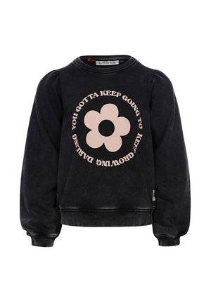 Zwarte sweatshirt met lange, gezwollen mouwen, ronde halslijn en een centrale roze bloemenafbeelding. Tekst omringt de bloem in een cirkelvormig patroon.