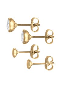 Gold-colored stud earrings featuring a round, clear gemstone with a dome-shaped setting and butterfly backs for secure wear.
