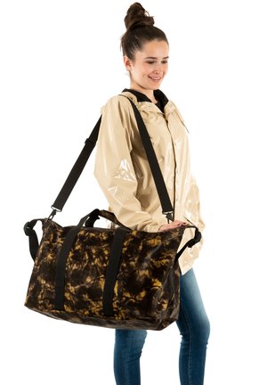 Large duffel bag in dark brown and gold marbled pattern, featuring black straps and hardware, made from a durable material. Ideal for versatile use.