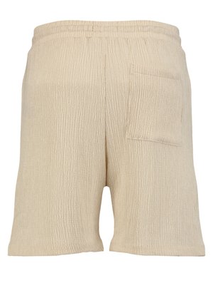 Beige gekreukte stoffen shorts met elastische tailleband en een enkele opgestikte zak aan de rechterkant.