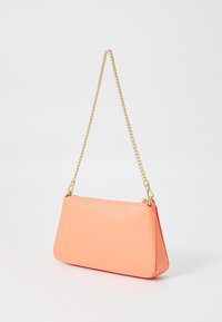 Peach-colored clutch bag made of smooth synthetic material, featuring a gold chain strap and a zip closure. Rectangular shape with rounded corners.
