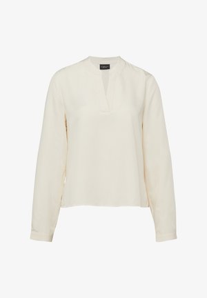 Long-sleeve cream blouse with a small standing collar and a V-shaped notch neckline, made from lightweight fabric.