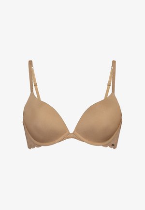 Reggiseno beige imbottito con ferretto e spalline regolabili, featuring dettagli in pizzo sulle ali laterali.