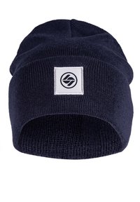 Navy knitted beanie with a folded cuff, featuring a white square patch with a black circular logo in the center. Soft texture and snug design.
