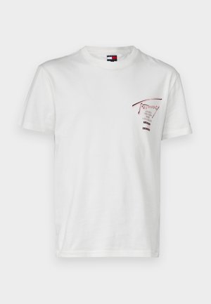 White cotton t-shirt with short sleeves and a round neck. Features a red graphic print on the left chest, showcasing brand names and locations.