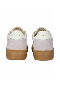 Pink suede sneakers with white leather accents and tan rubber soles. Gold branding on the heel. Rounded design with padded collar.