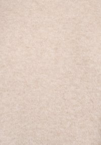 Béžová vlněná látka s jemnou rebrovanou textúrou, zobrazuje mäkký a teplý pletený materiál v detailnom zábere.