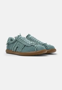 Textured, frayed light teal fabric shoes with round laces, rubber sole, and minimalistic design. Features a soft, casual silhouette.