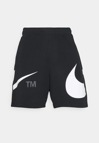 Czarne szorty wykonane z miękkiej tkaniny, z białymi logo Nike Swoosh oraz małym szarym logo „TM” po jednej stronie. Klasyczna elastyczna talia.