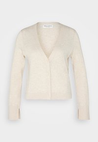 Cardigan beige con scollatura a V, maniche lunghe e chiusura con bottoni. Tessuto morbido, con fessure laterali e vestibilità casual.