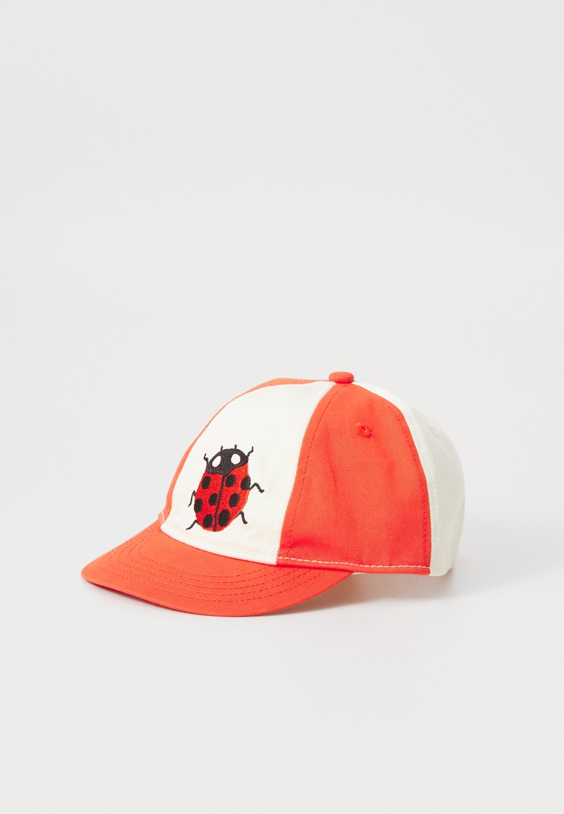 Red and white cap with a rounded crown and curved visor; features an embroidered ladybug design on the front panel.