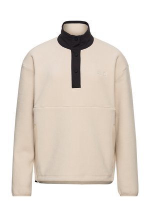 Roomkleurige fleece trui met een zwarte drukknoopsluiting en kraag. Voorzien van een buidelzak en een gladde textuur, geschikt om meerdere lagen mee te dragen.