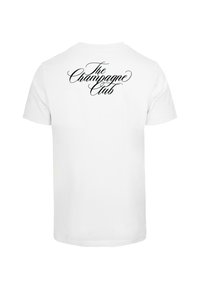 Camiseta de algodón blanca con el texto "El Club del Champán" en elegante cursiva negra en la parte trasera. Diseño sencillo de mangas cortas.