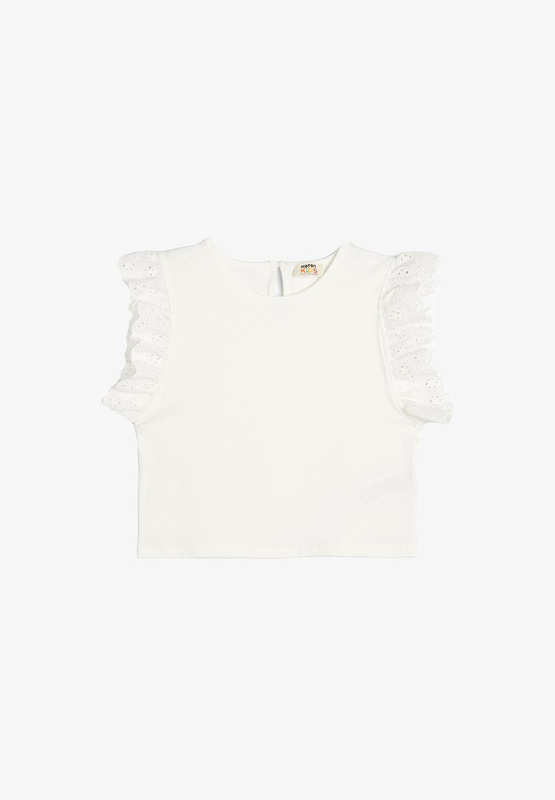 White short-sleeved cotton top with ruffled lace accents on sleeves, round neck, and a small button closure at the back.