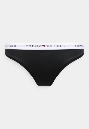 Chiloti de bikini negri din bumbac, cu talie elastică albă, având logo-ul "TOMMY HILFIGER" și un mic emblemă colorată. Textură netedă.