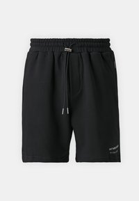 Black sweat shorts with an elastic waistband and drawstring. Features side pockets and embroidered text on the lower left. Soft fabric.