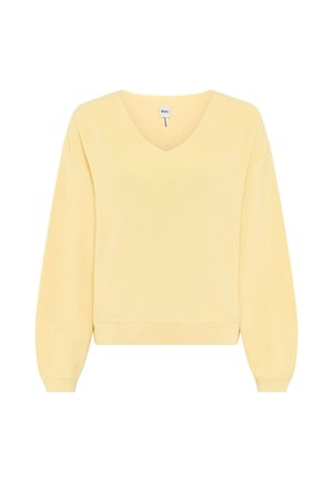 Pull en maille jaune clair à col en V, manches longues avec poignets et ourlet côtelés, présenté sur un fond blanc.