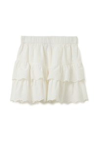 Falda blanca de algodón con bordado de ojales, de varias capas. Presenta una cintura elástica y bordes con forma de ondas en cada capa.